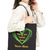 You are Loved, Seen, Never Alone Canvas Tote in Black held by female model