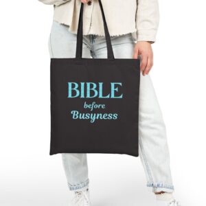 Bible Before Busyness Canvas Tote in Black held by model
