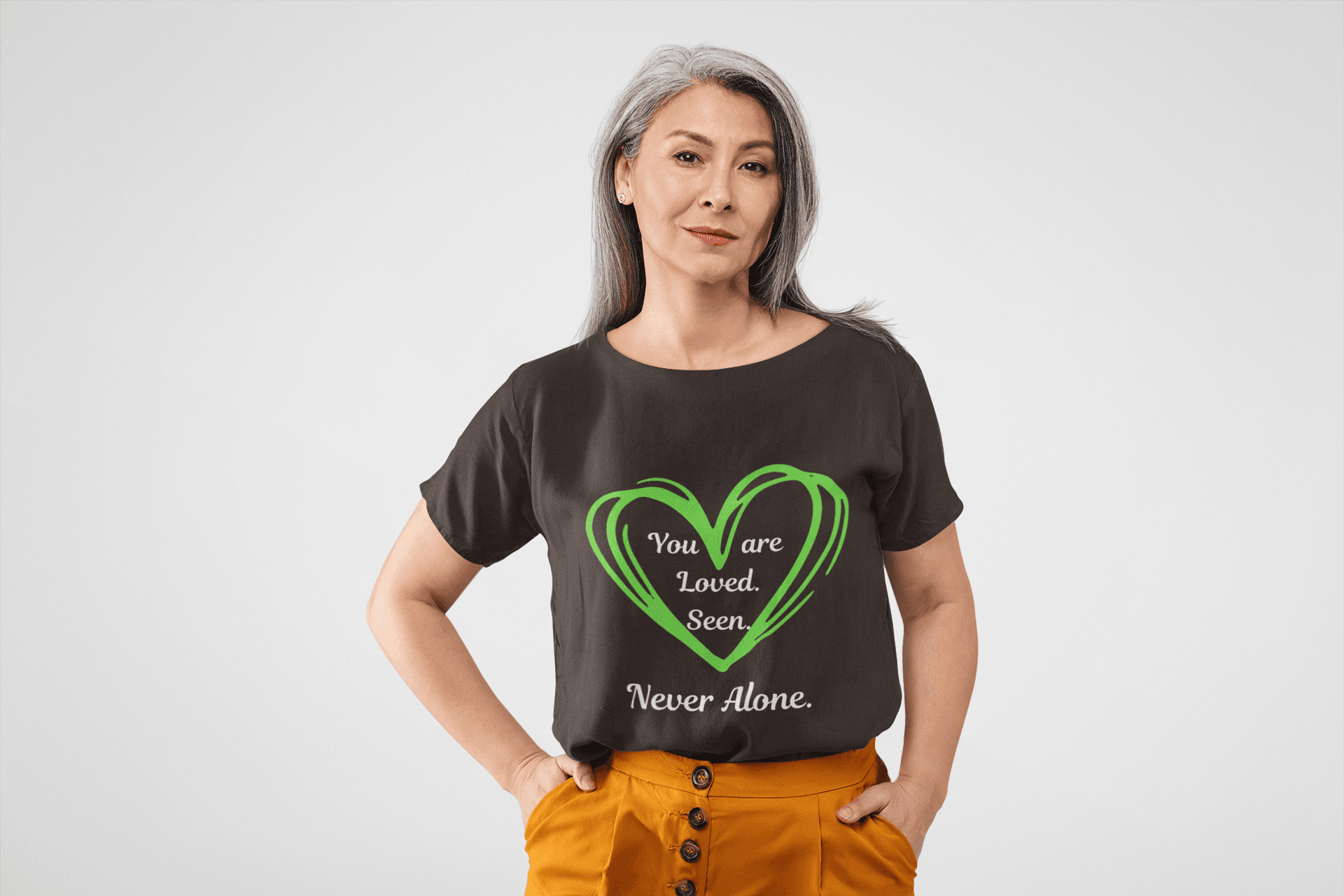 You are Loved, Seen, Never Alone Short Sleeve Tee in Dark Chocolate, front view, worn by female model.