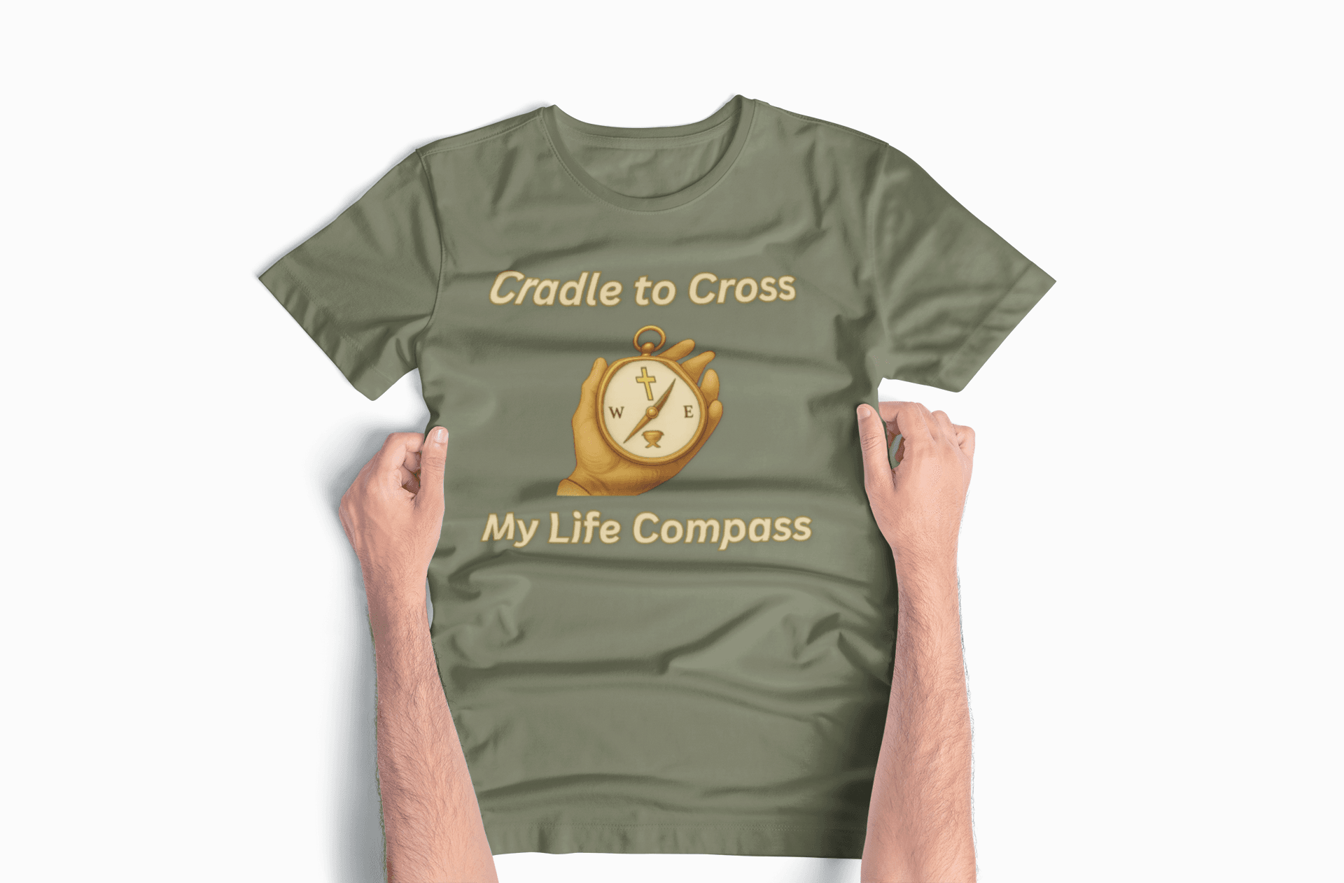 Cradle to Cross - My Life Compass in Military Green, laid out flat with hands smoothing out wrinkles