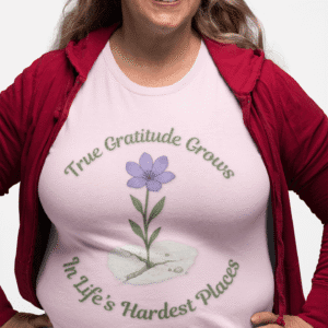 True Gratitude Grows...Hard Places Short Sleeve T-shirt in Light Pink on plus size model wearing red sweater.