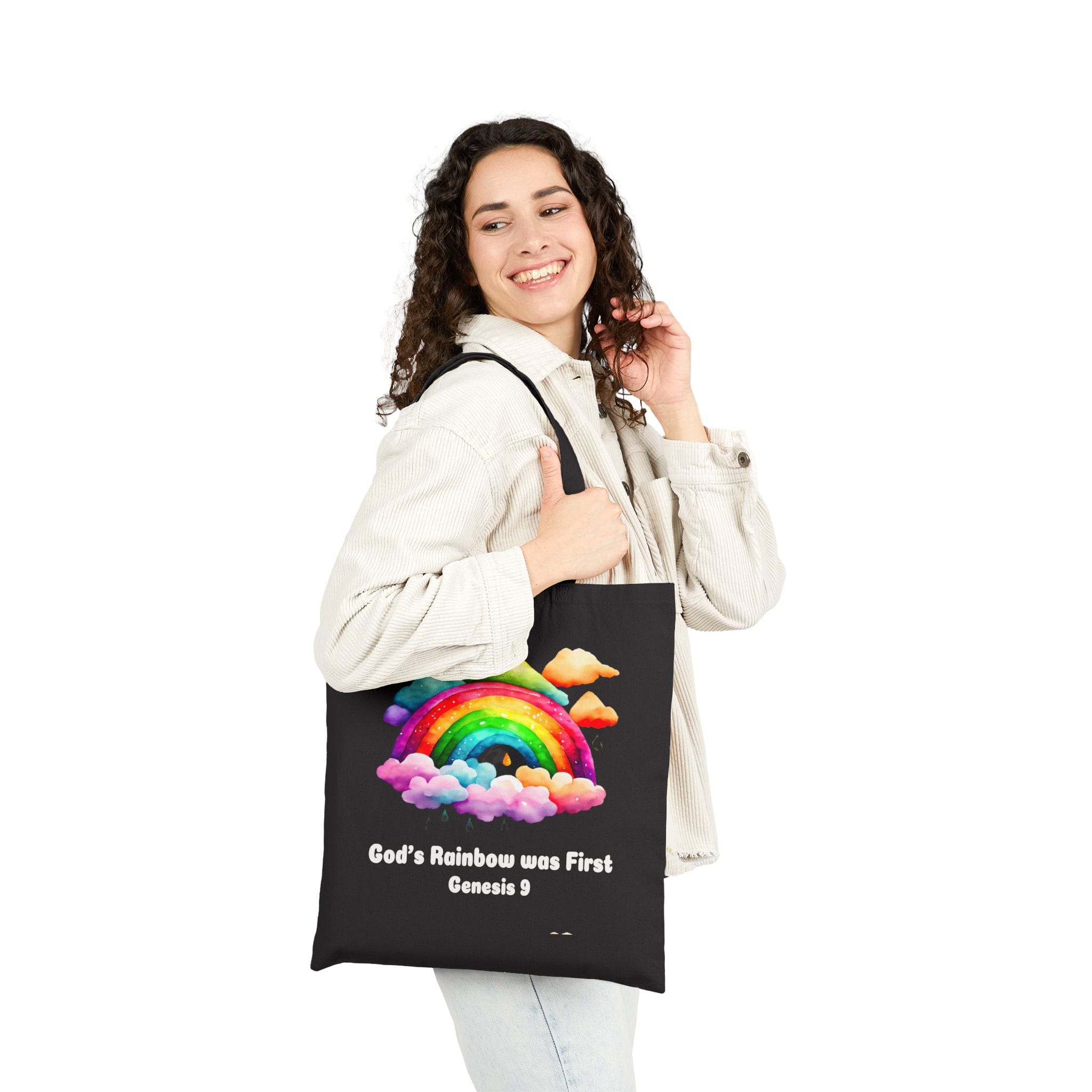 God's Rainbow was First Canvas Tote Bag in Black on shoulder of female model