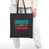 Character over Charm Canvas Tote in Black held by model