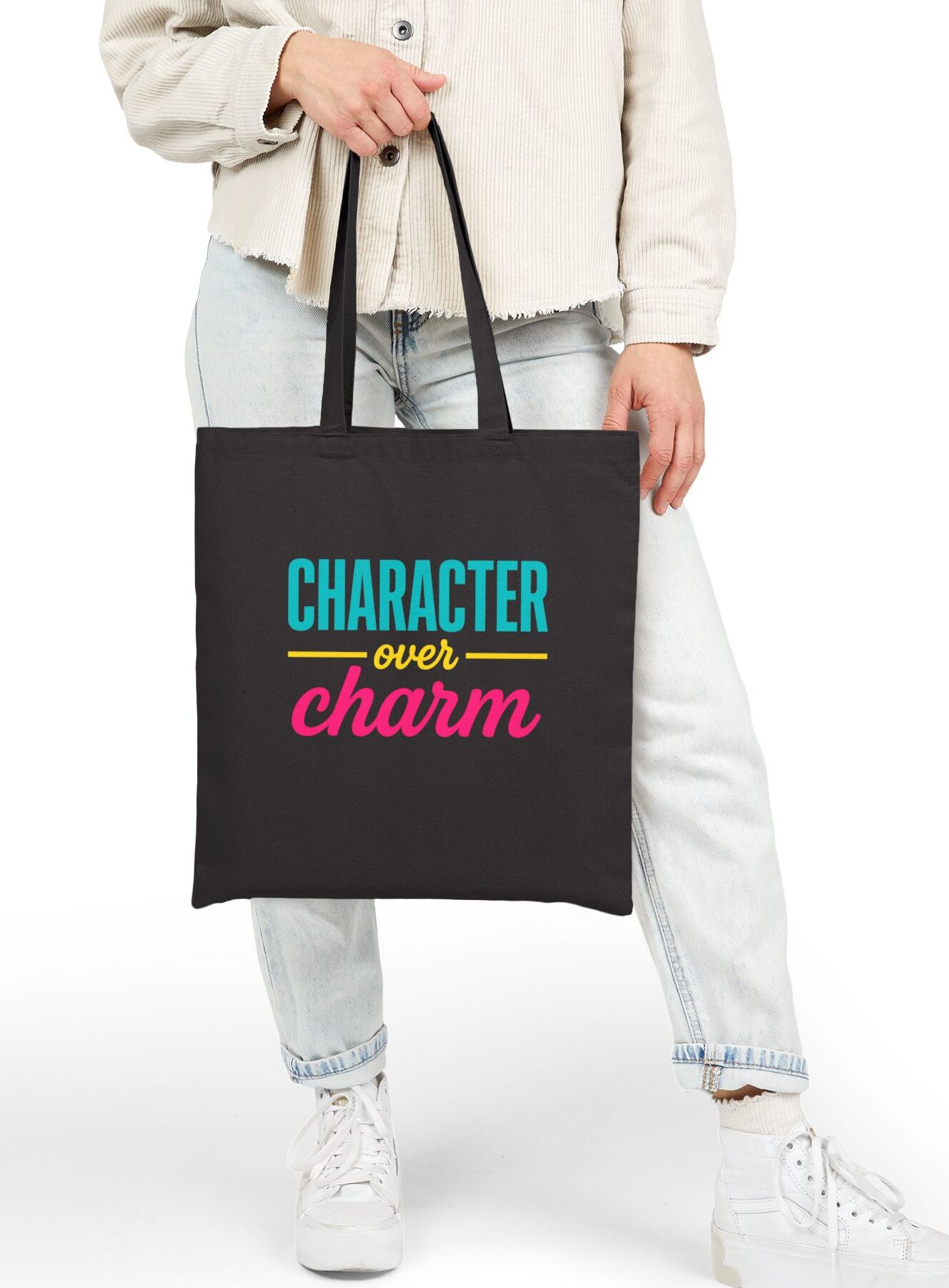 Character over Charm Canvas Tote in Black held by model