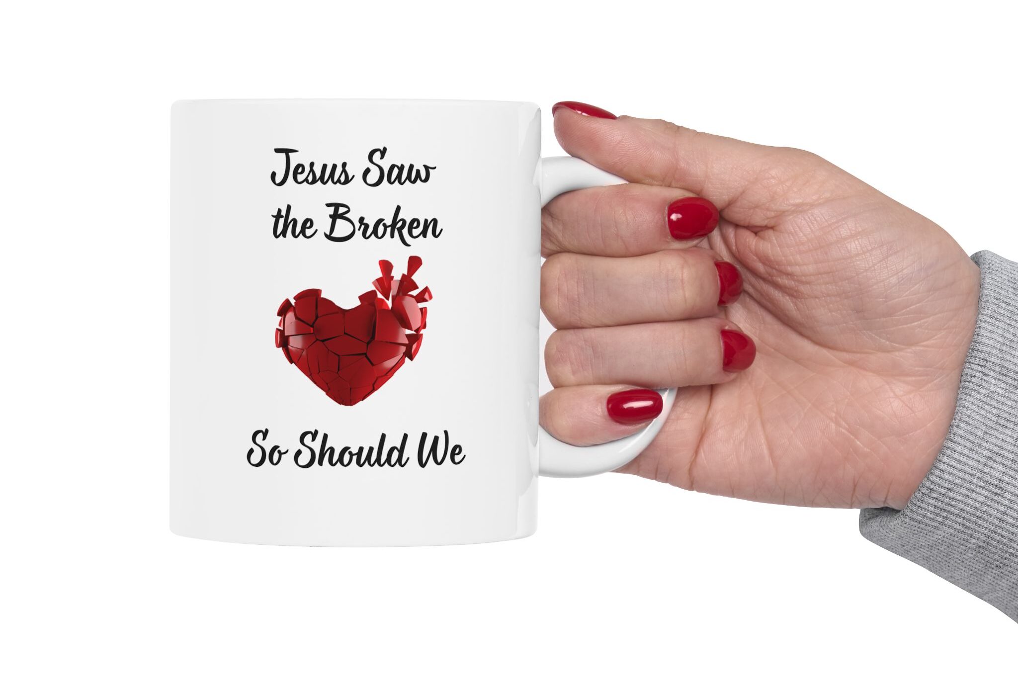 "Jesus Saw the Broken Hearted" Ceramic Mug held by a woman's hand