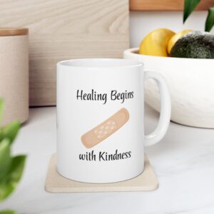 "Healing Begins with Kindness" Ceramic Mug on kitchen countertop
