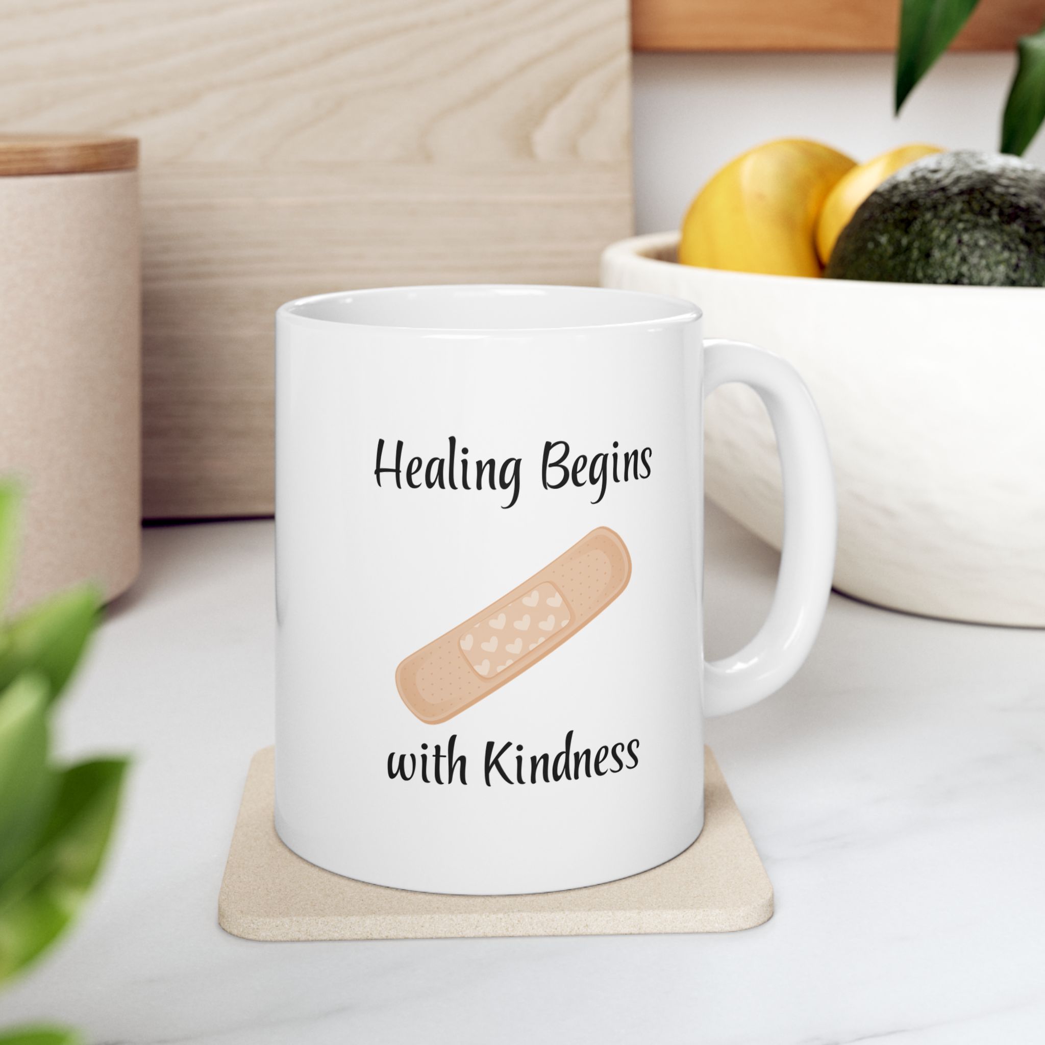 "Healing Begins with Kindness" Ceramic Mug on kitchen countertop