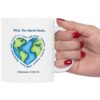 "What the World Needs..." Ceramic Mug held in female model hand