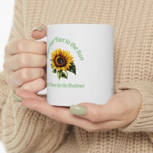 "Keep Your Face to the Sun" Sunflower Ceramic Mug held by female model