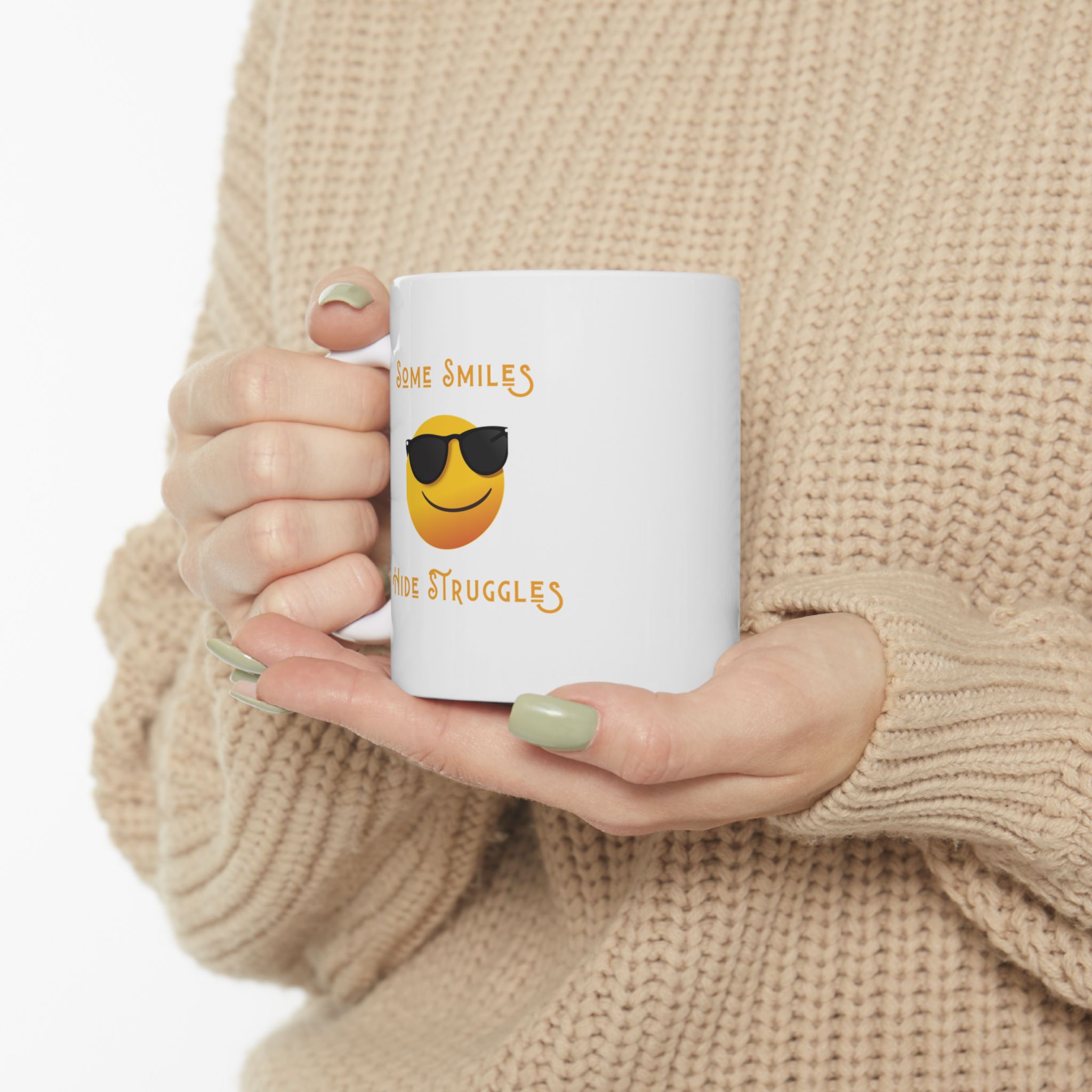 "Some Smiles Hide Struggles" Ceramic Mug held in woman's hands