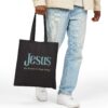 “Jesus – My Reason to Keep Going” Canvas Tote in Black being held by male model