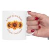 "A Kind Word" Sunflower Ceramic Mug held in a woman's hand