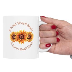 "A Kind Word" Sunflower Ceramic Mug held in a woman's hand