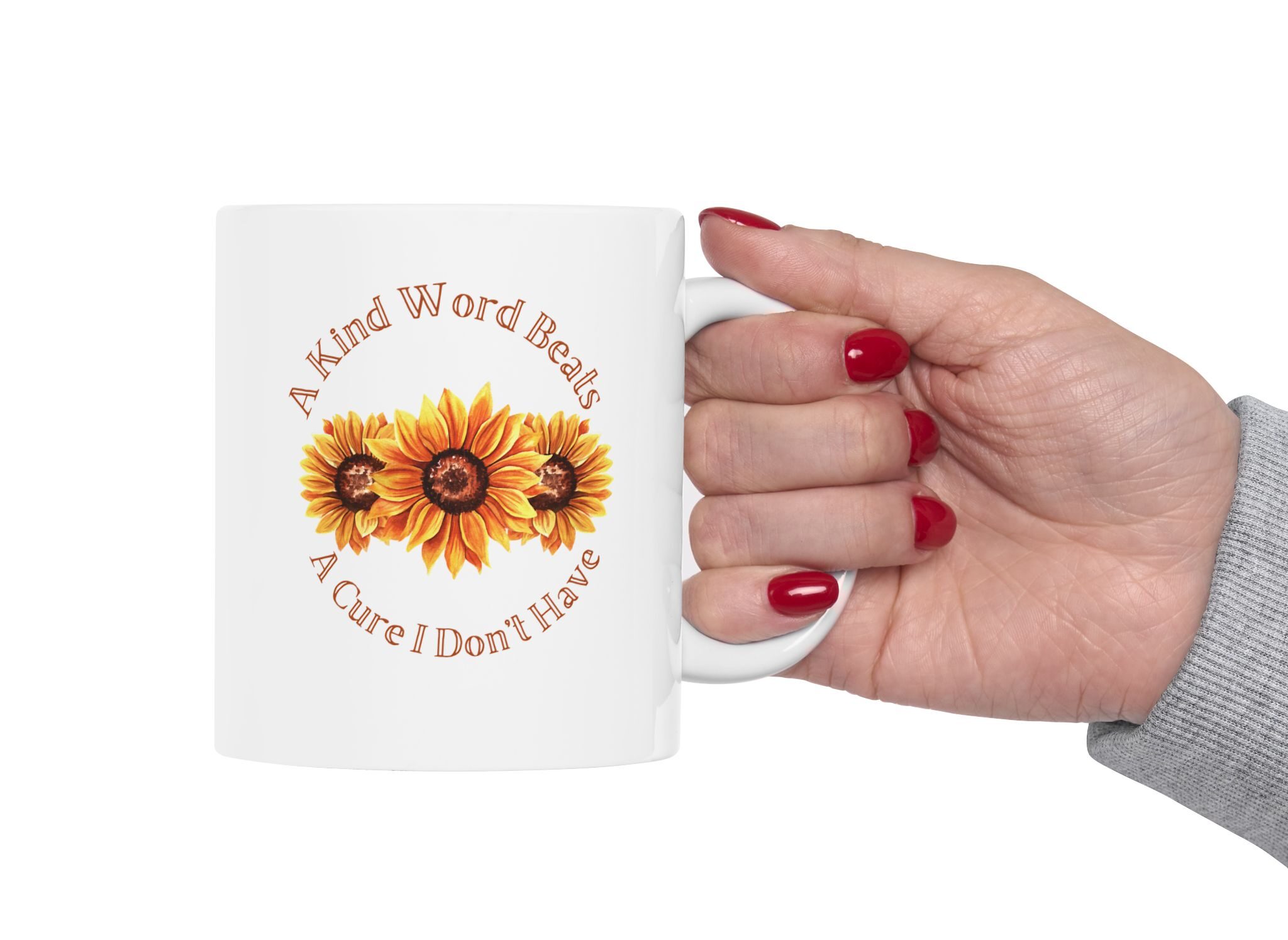 "A Kind Word" Sunflower Ceramic Mug held in a woman's hand