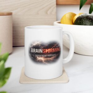 "Brainstorming: Migraine Edition" Ceramic Mug on kitchen counter
