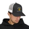 "Some Smiles Hide Struggles" Embroidered Trucker Cap in black/white on male model