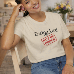 Energy Level Out of Order Short Sleeve Tee in Sand on woman sitting in dining room