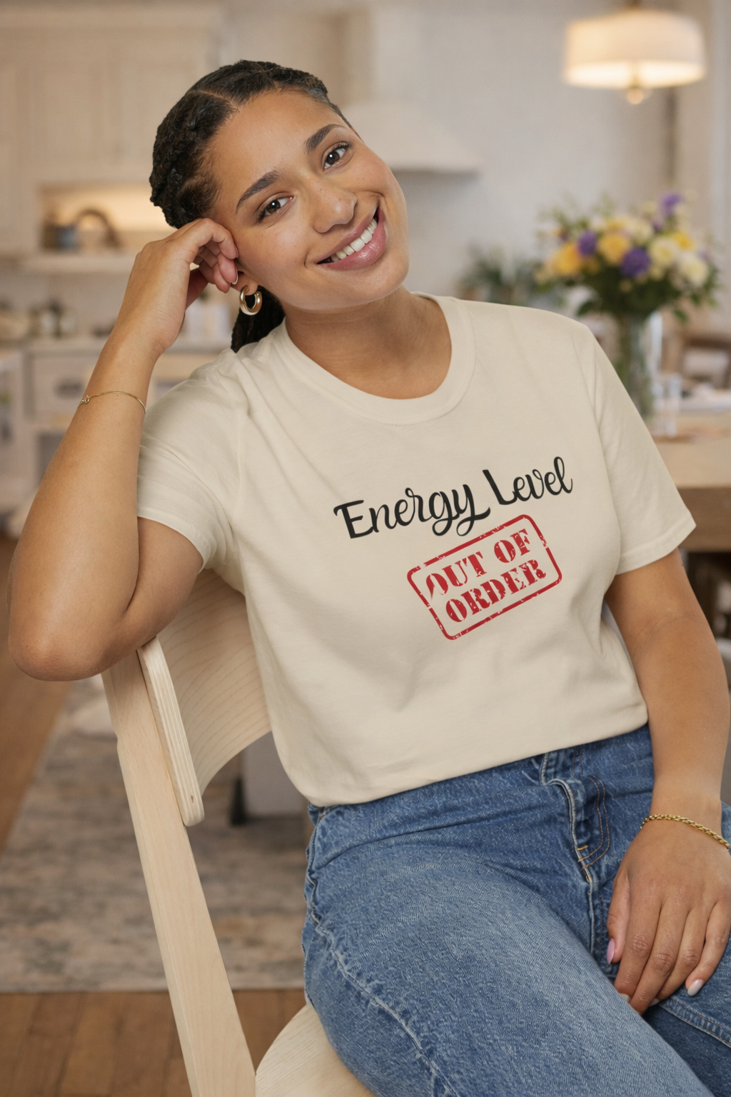 Energy Level Out of Order Short Sleeve Tee in Sand on woman sitting in dining room